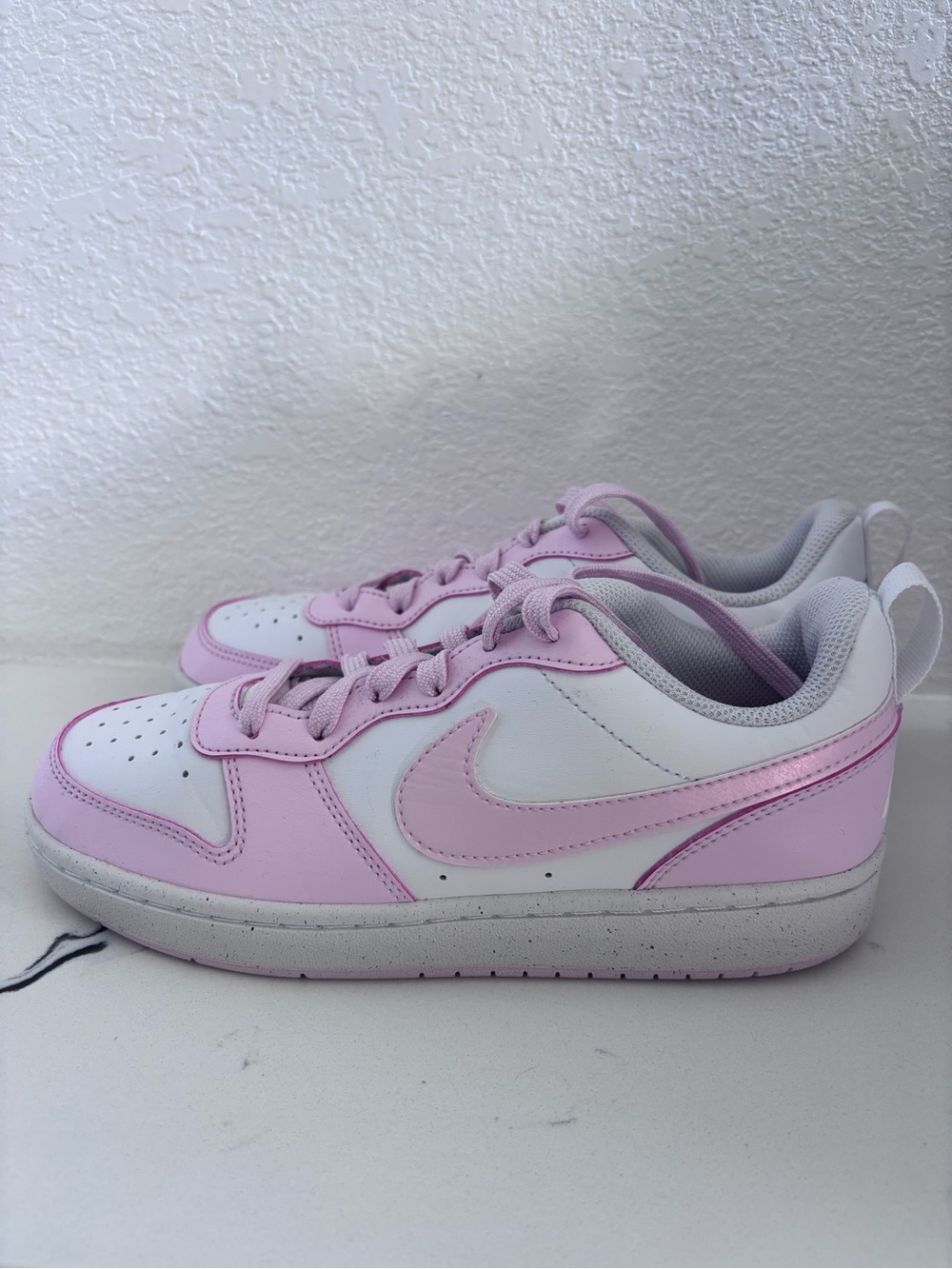 Pink and white Nikes